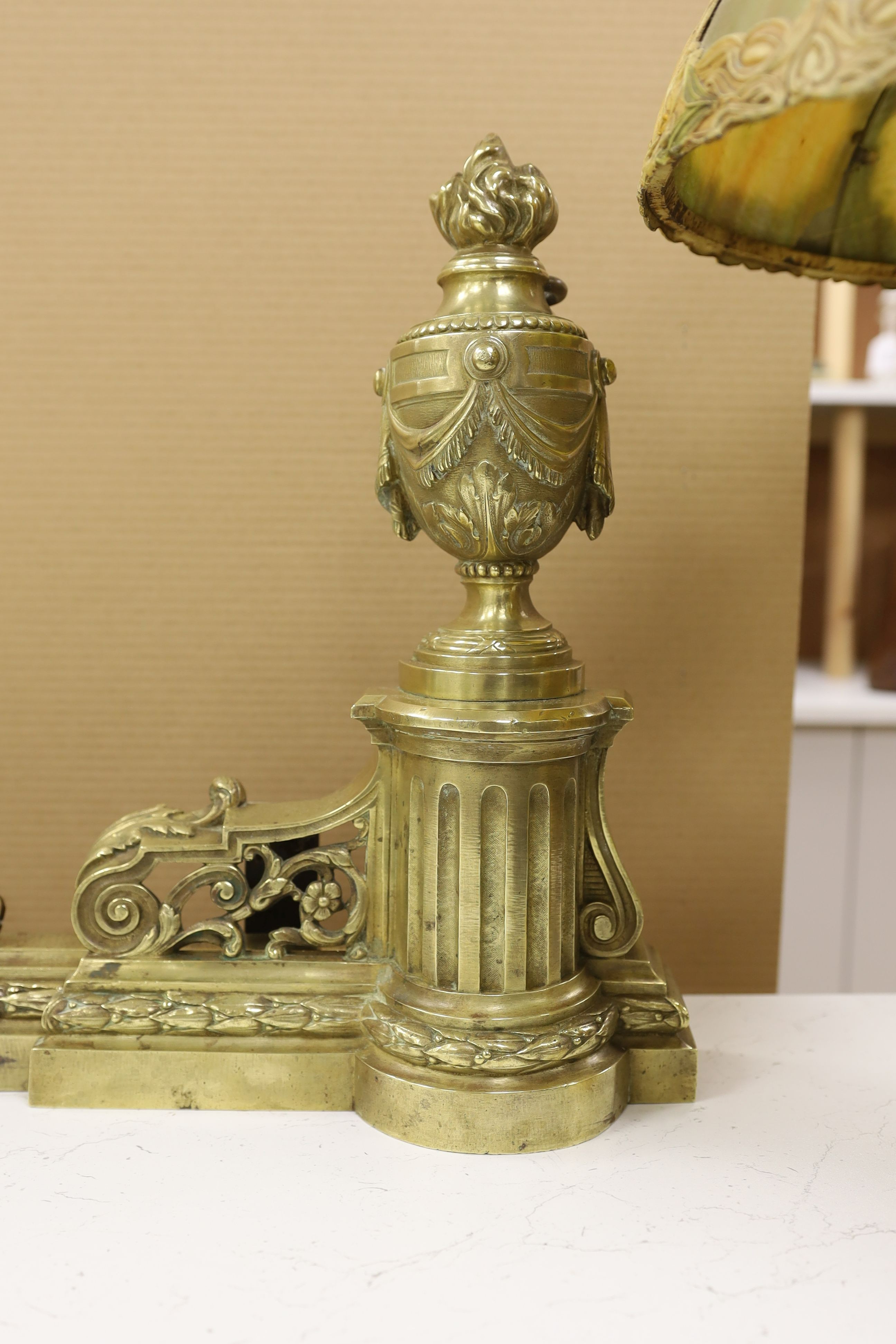 A Louis XVI style adjustable bronze chenet